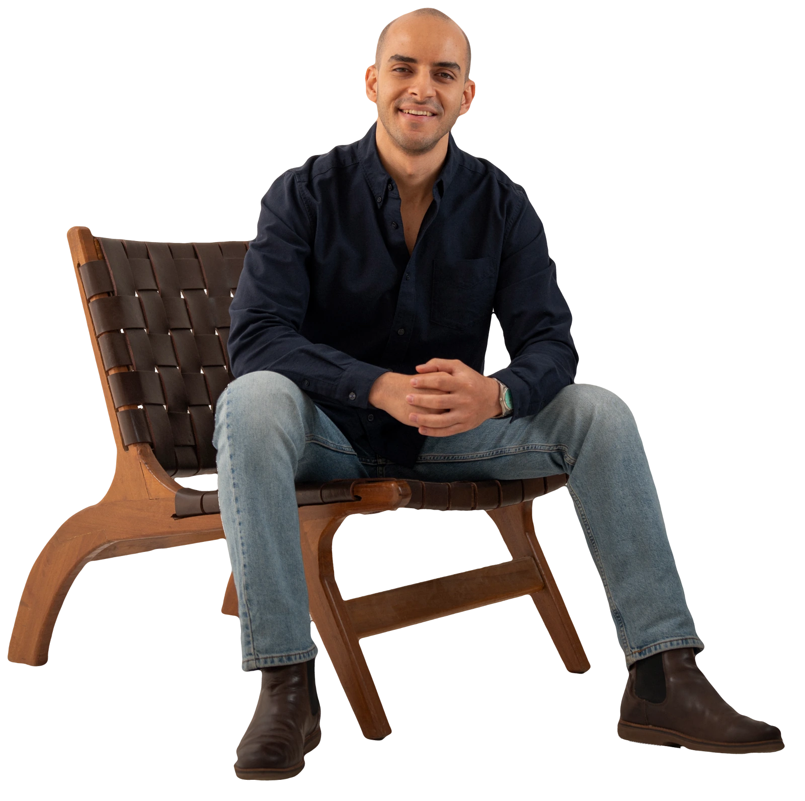 Yahia Elghayesh seated in his studio